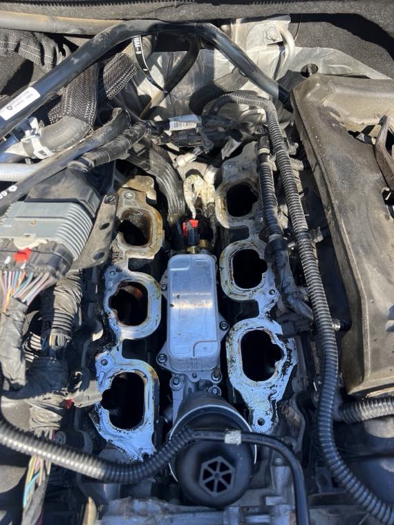 Engine with the intake manifold removed, exposing the cylinder head ports